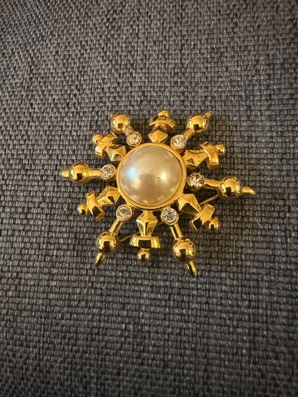 Marvella Starburst Gold Tone Brooch with Faux Pearl Center & Clear Rhinestones.